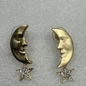 Pair of gold colored cresent earings with‎ star dangle